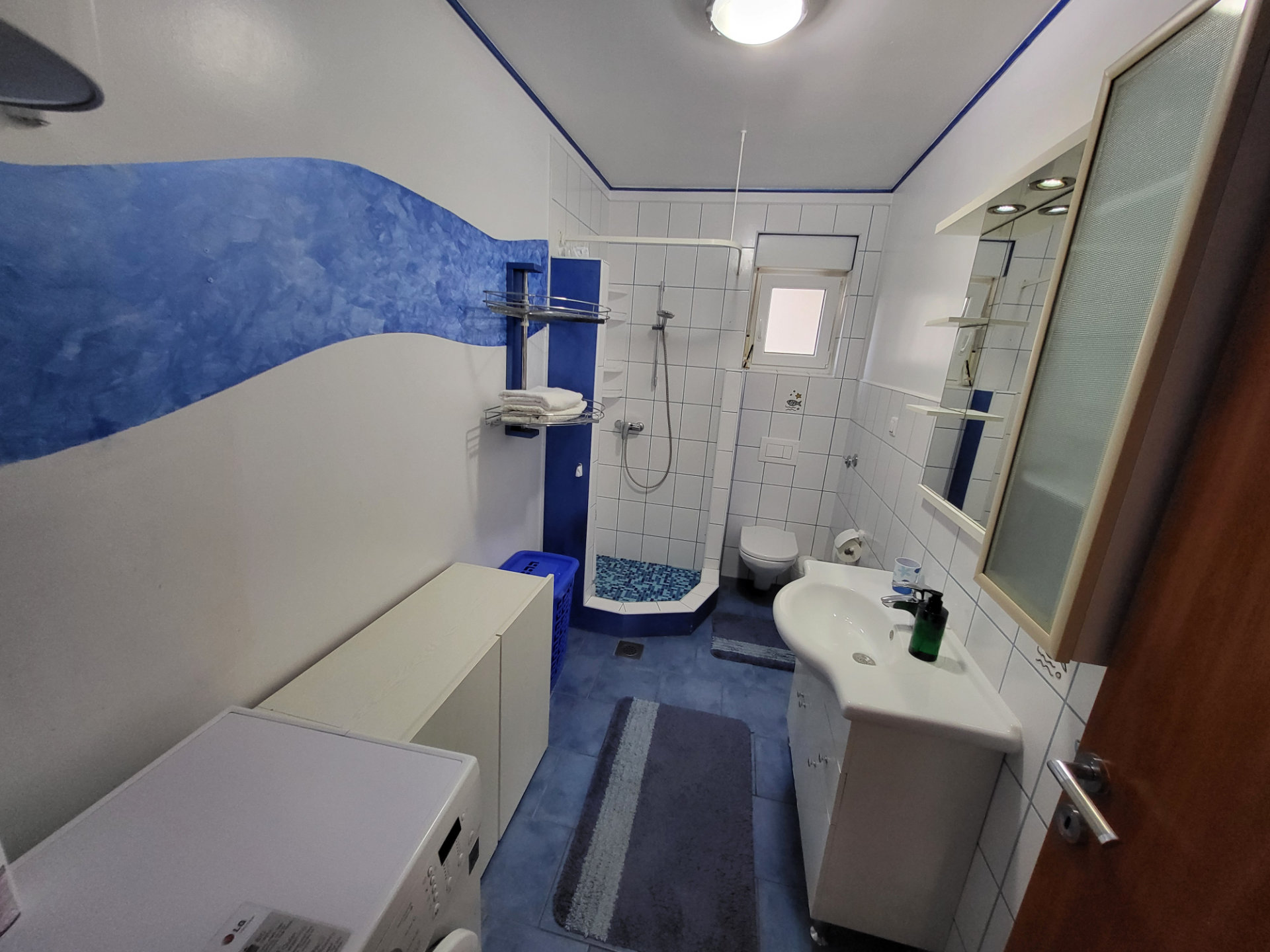 Blue tile spacious bathroom